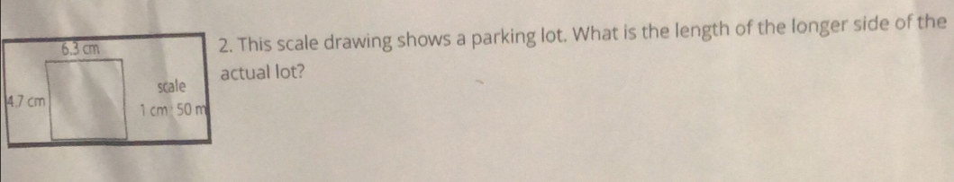 This scale drawing shows a parking lot. What is the length of the longer side of the 
actual lot?