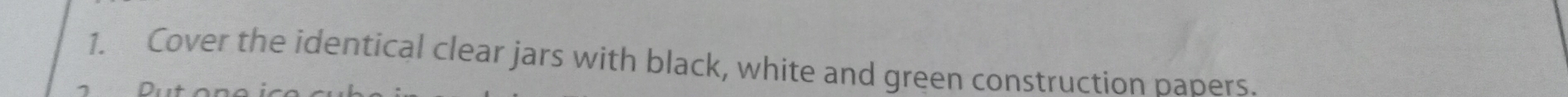 Cover the identical clear jars with black, white and green construction babers.