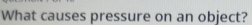 What causes pressure on an object?