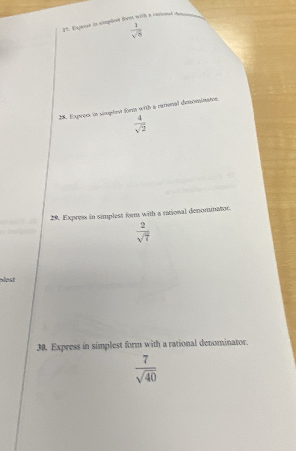 Express in simplest form with a rational donoms
 1/sqrt(8) 
28. Express in simplest form with a rational denominator.
 4/sqrt(2) 
29. Express in simplest form with a rational denominator.
 2/sqrt(7) 
plest 
30. Express in simplest form with a rational denominator.
 7/sqrt(40) 