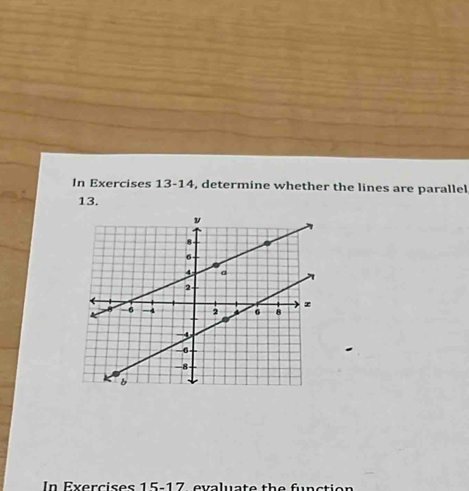 In Exercises 13-14, determine whether the lines are parallel, 
13.