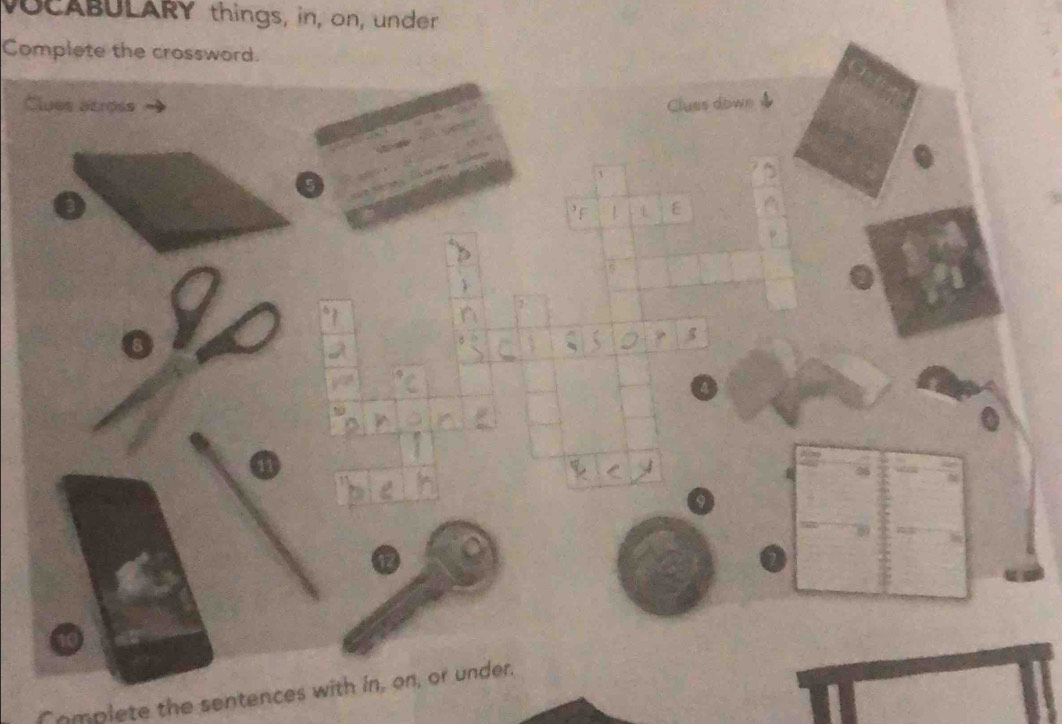 VOCABULARY things, in, on, under 
Complete the crossword. 
Clues atross Cluss down 
L ε 
P 
Complete the sentences with in, on, or under.