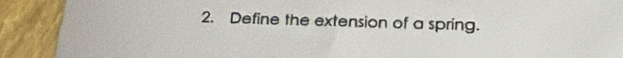 Define the extension of a spring.