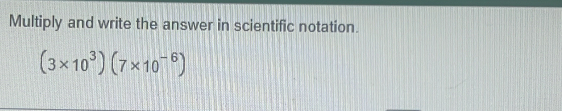 Multiply and write the answer in scientific notation.
(3* 10^3)(7* 10^(-6))