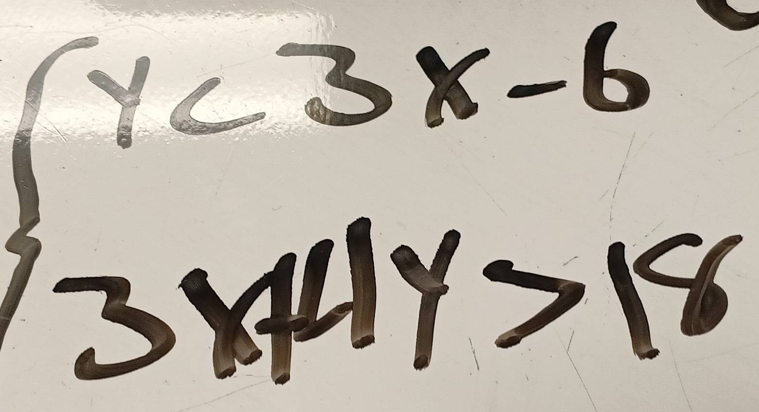 beginarrayl y<3x-6 3x+4y>18endarray.