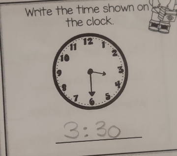 Write the time shown on 
the clock.