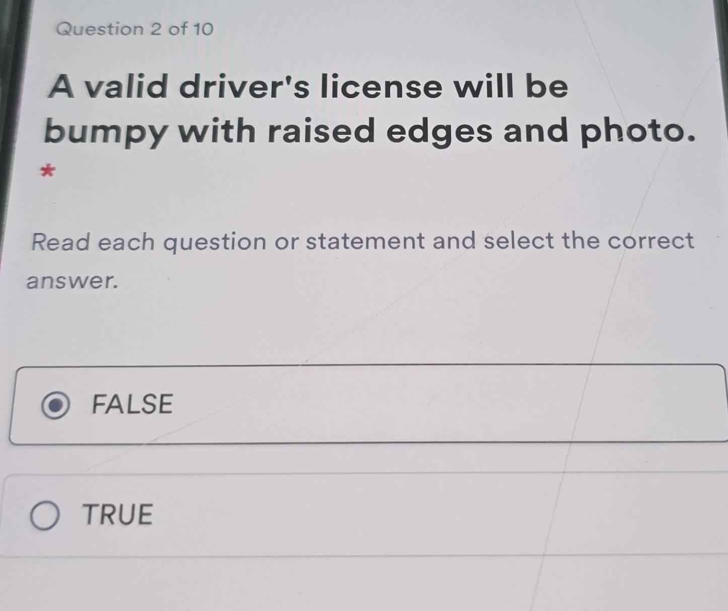 Solved: A valid driver's license will be bumpy with raised edges and ...