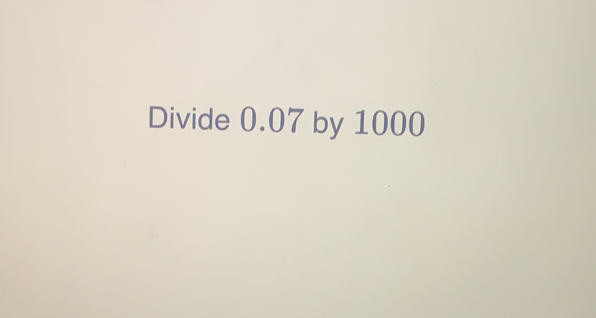 Divide 0.07 by 1000