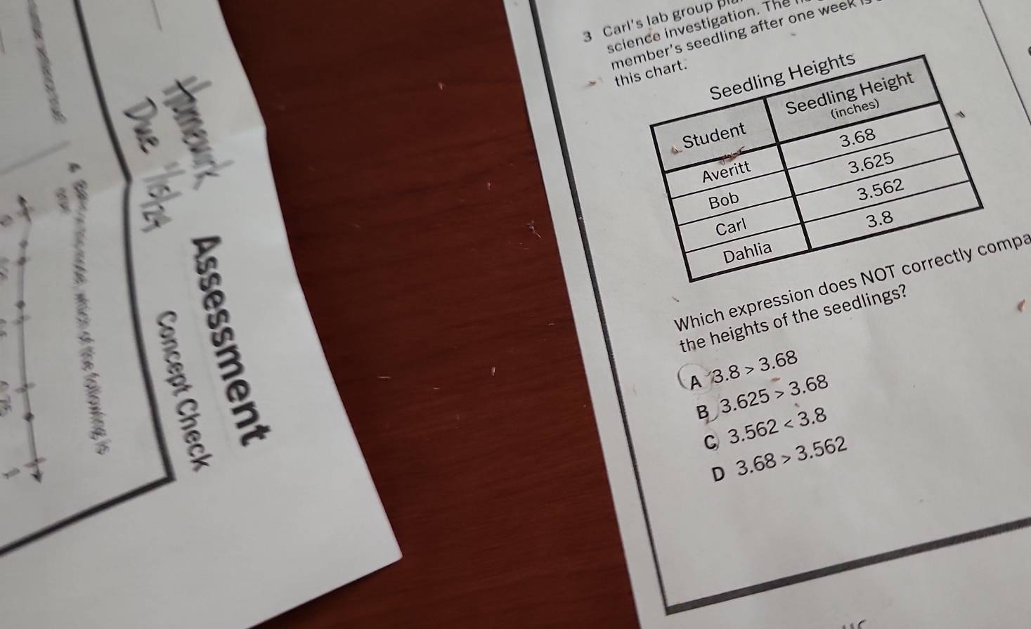 Carl's lab group 
science investigation. The
ms seedling after one week th

Which expression pa
the heights of the seedlings?
A 3.8>3.68
B 3.625>3.68
C 3.562<3.8
D 3.68>3.562