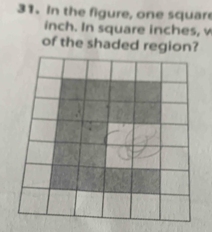 In the figure, one square
inch. In square inches, w 
of the shaded region?