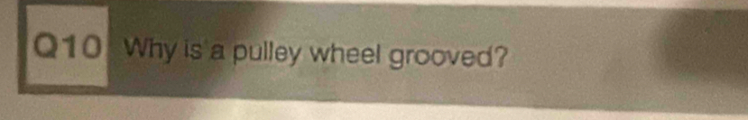 Why is a pulley wheel grooved?