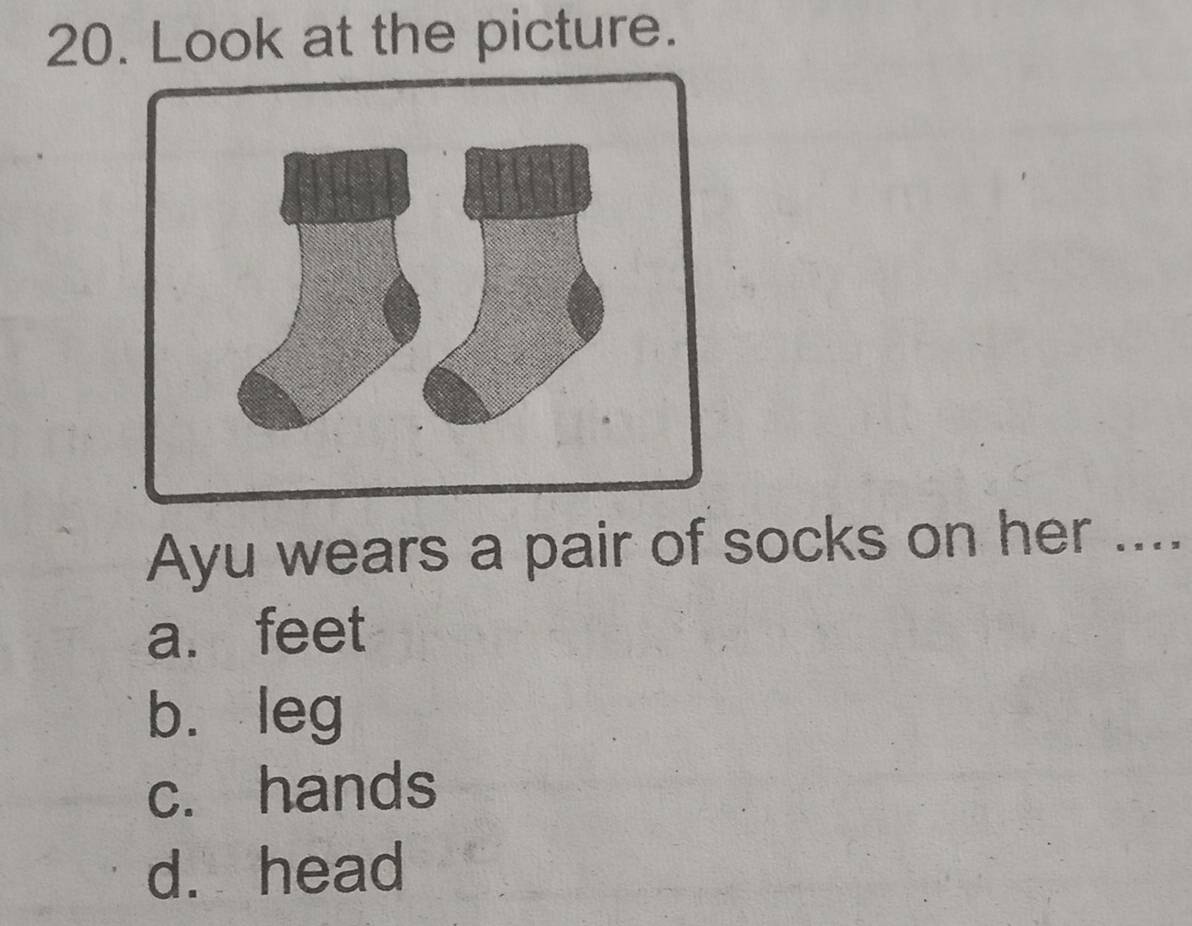 Look at the picture.
Ayu wears a pair of socks on her ....
a. feet
bù leg
c. hands
d. head